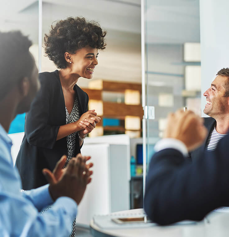 a group of business colleagues laughing