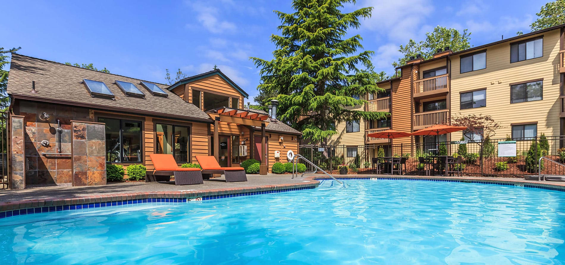 pool area and clubhouse of an apartment building